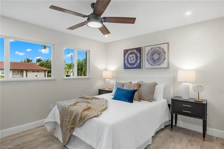 Bedroom featuring light hardwood / wood-style flooring and ceiling fan
