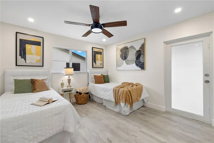 Bedroom featuring light hardwood / wood-style flooring and ceiling fan