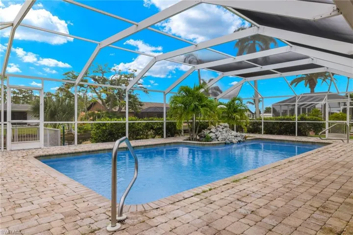 View of pool featuring a patio area and a lanai