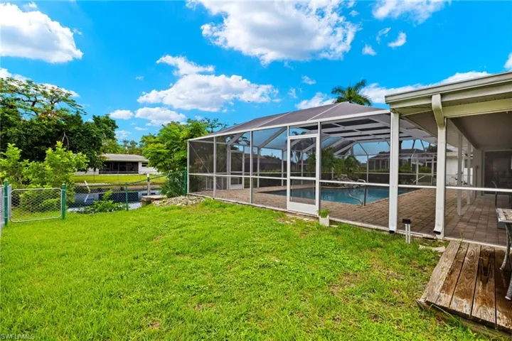 View of yard featuring a lanai and a patio