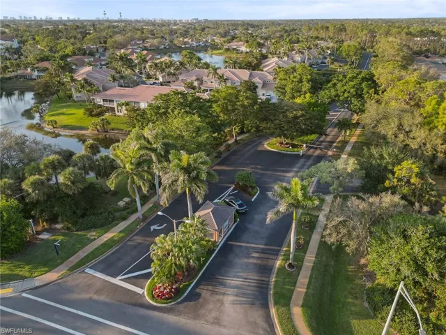 Aerial view with a water view and a residential view