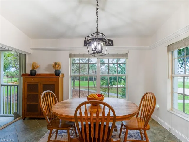 Dining space featuring hanging lights and baseboards