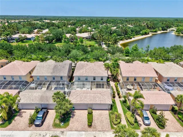 Aerial perspective of suburban area with a large body of water