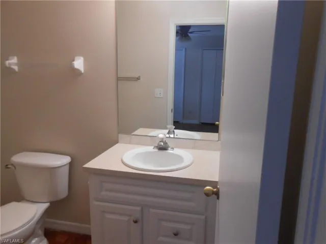Half bath with vanity and toilet