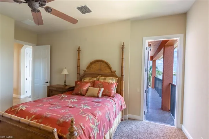 2nd floor bedroom. Door to balcony area. Great water views. On the other side of home from the master, perfect as a guest room.