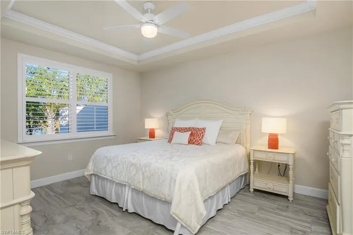 Bedroom featuring a tray ceiling,  and crown molding