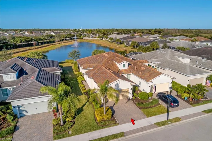 Drone / aerial view featuring a water view and a residential view