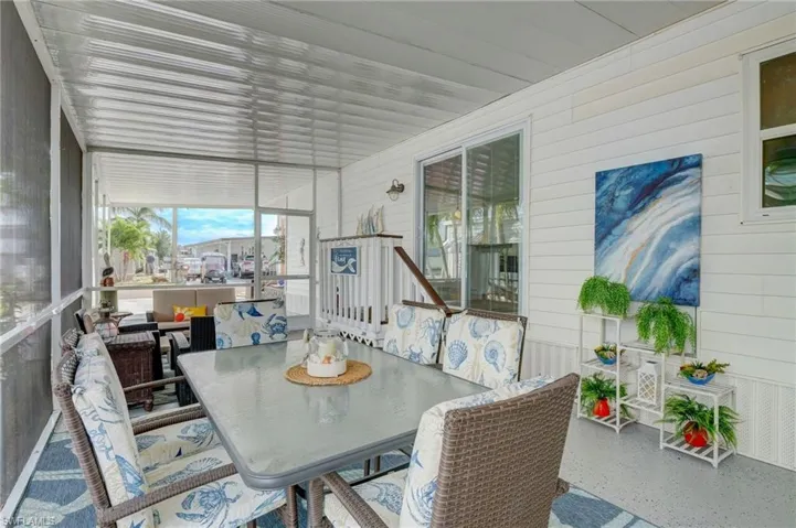 Sunroom / solarium featuring outdoor dining space