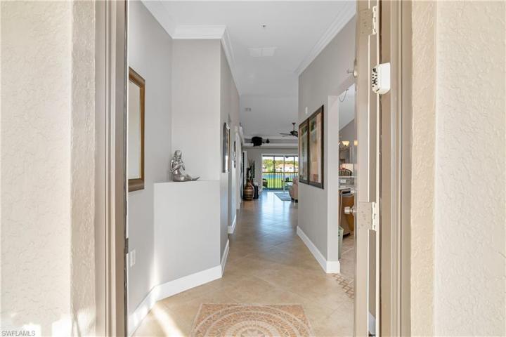 Front Door: enter from West, into foyer; kitchen on right, guest suite on left