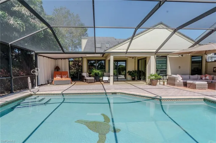 Outdoor pool with outdoor seating, a sunroom, and a lanai