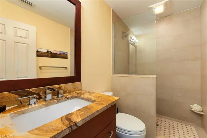 Full bathroom with walk in shower and vanity