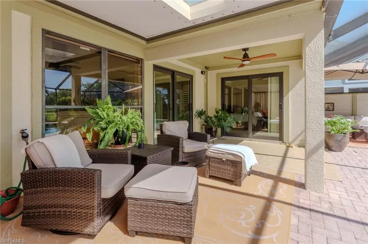 View of patio featuring outdoor seating and ceiling fan