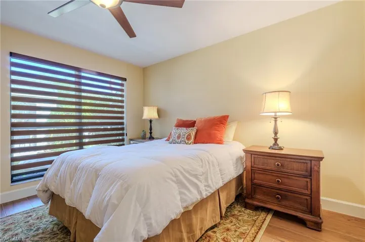 Bedroom featuring light wood-style floors and a ceiling fan