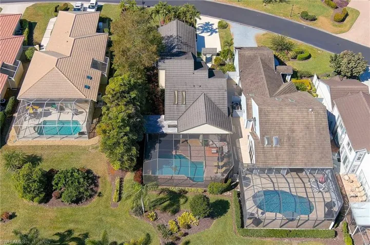 Aerial view of residential area featuring a pool