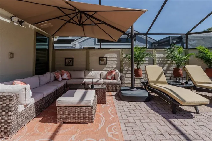 View of patio / terrace featuring a sunroom and a lanai