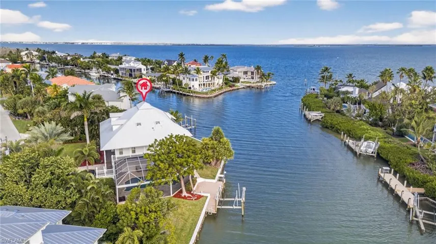 Aerial perspective of suburban area with a nearby body of water