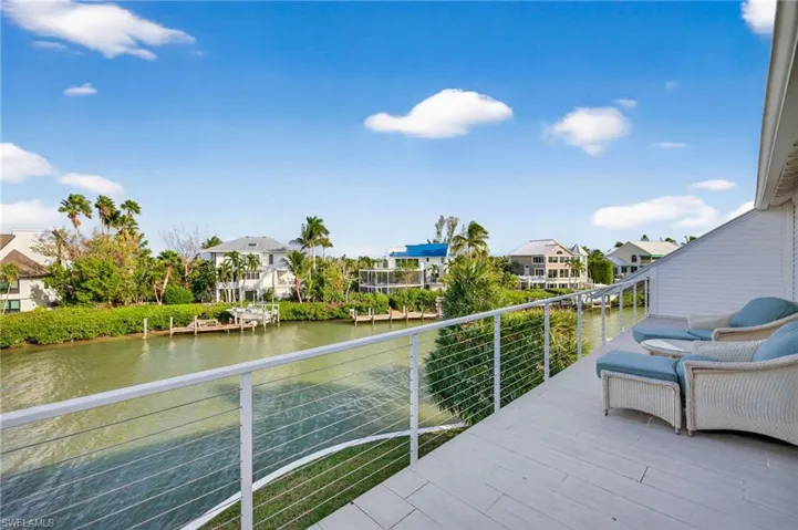 Balcony with a water view and a residential view