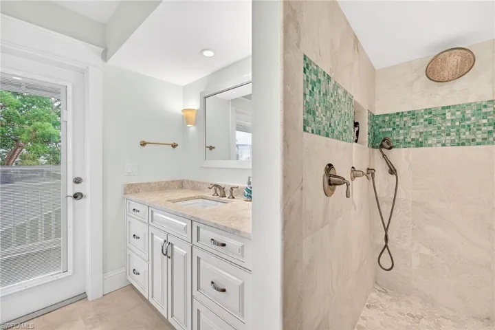Bathroom with walk in shower and vanity