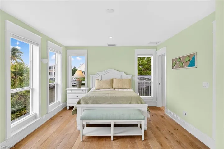 Bedroom featuring light wood-type flooring and baseboards