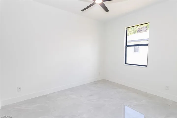 Bedroom featuring baseboards and a ceiling fan