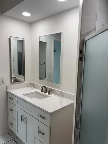 Adjoining Master bath features wood cabinetry, under mount sink and granite counter and good storage