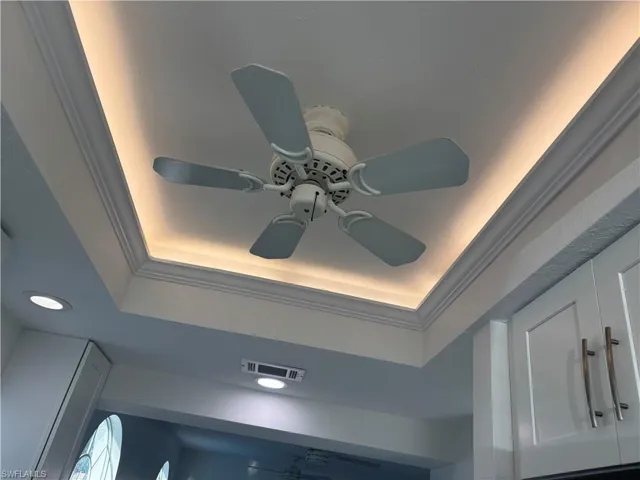 Along with recessed lighting, the kitchen also features ceiling fan and accent ceiling lighting.