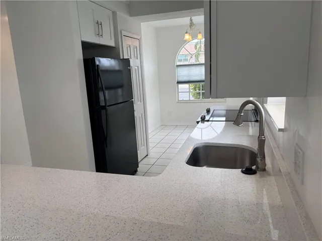 New refrigerator, wall pantry and plenty of counter space. Breakfast room beyond.