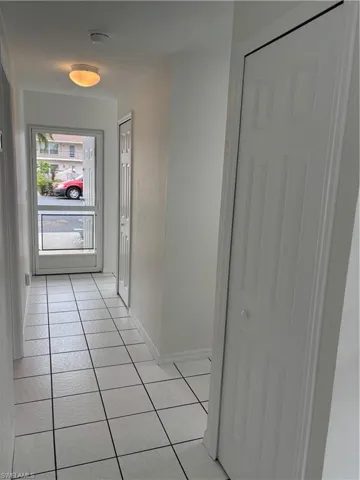 Unit boasts a screened front door for great breezes, along with 2 additional hallway storage closets.