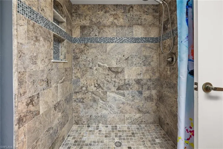 Bathroom with curtained shower