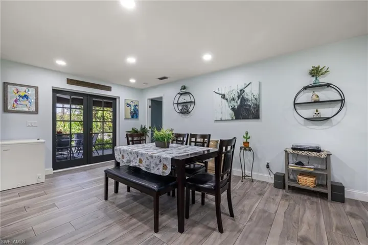 Dining space featuring french doors and light hardwood / wood-style flooring