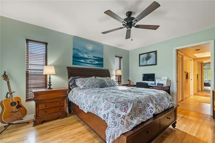 Bedroom featuring ceiling fan and light hardwood / wood-style floors