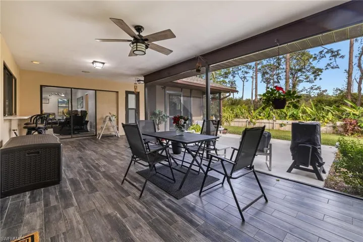 Sunroom / solarium featuring ceiling fan