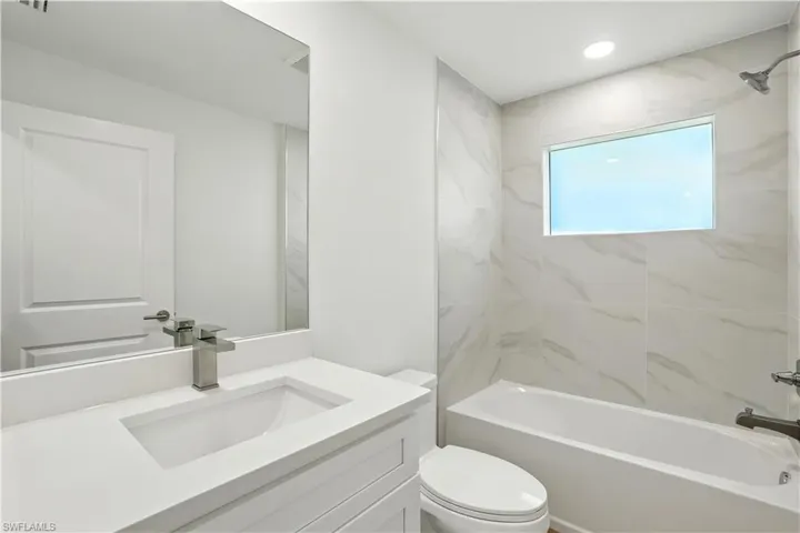 Full bathroom with vanity and shower / bath combination