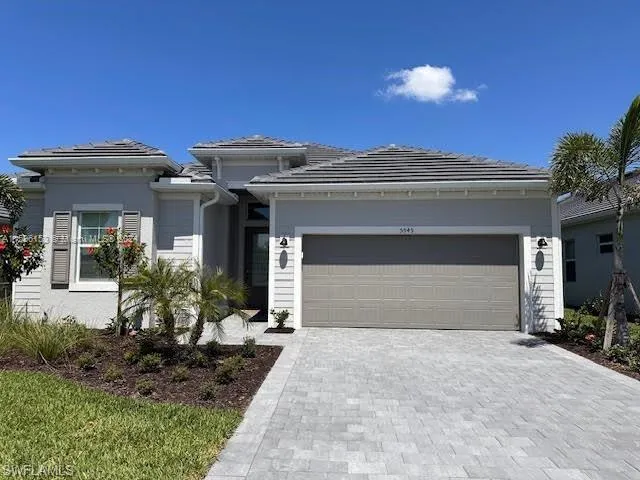 View of front of property featuring a garage