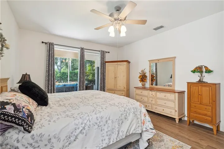 Bedroom featuring ceiling fan and hardwood / wood-style flooring