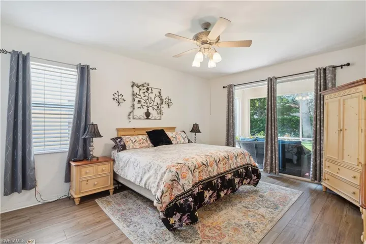 Bedroom featuring hardwood / wood-style floors and ceiling fan