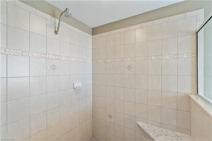 Bathroom featuring tiled shower