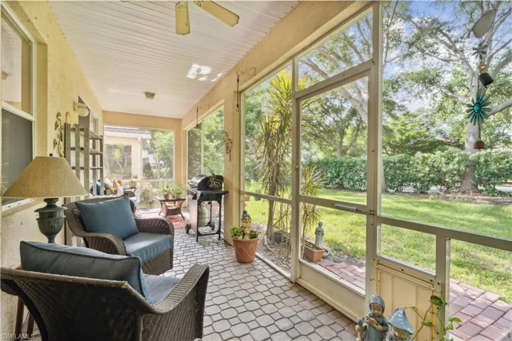 Sunroom / solarium featuring ceiling fan and a healthy amount of sunlight