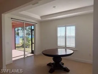 Recessed tray ceiling complemented by tile flooring