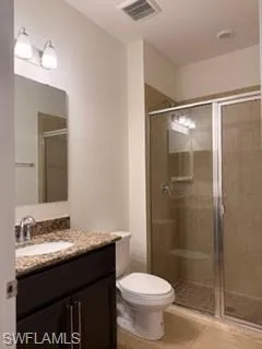 Contemporary jack and Jill  bathroom featuring a dark wood-finish vanity with a granite countertop, undermount sink, and chrome fixtures