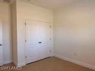 Double bifold closet doors with dark hardware