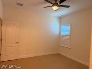 Second masters Interior room featuring light-colored walls and tiled flooring