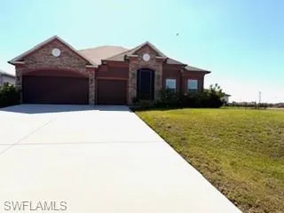 3 car garage  home featuring a two-car garage, a single garage, and a concrete driveway
