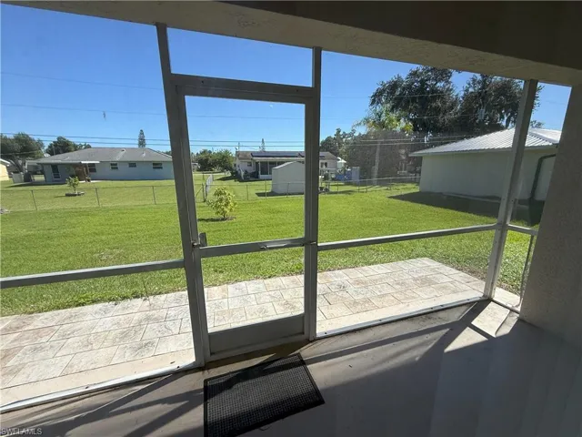 Unfurnished sunroom with a patio