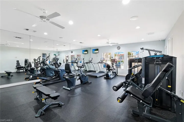 Gym with recessed lighting and ceiling fan