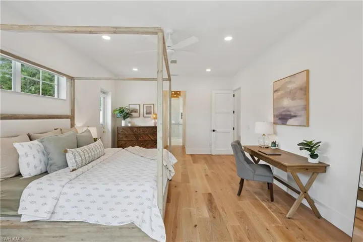 Bedroom with light wood-style floors, recessed lighting, baseboards, and a ceiling fan