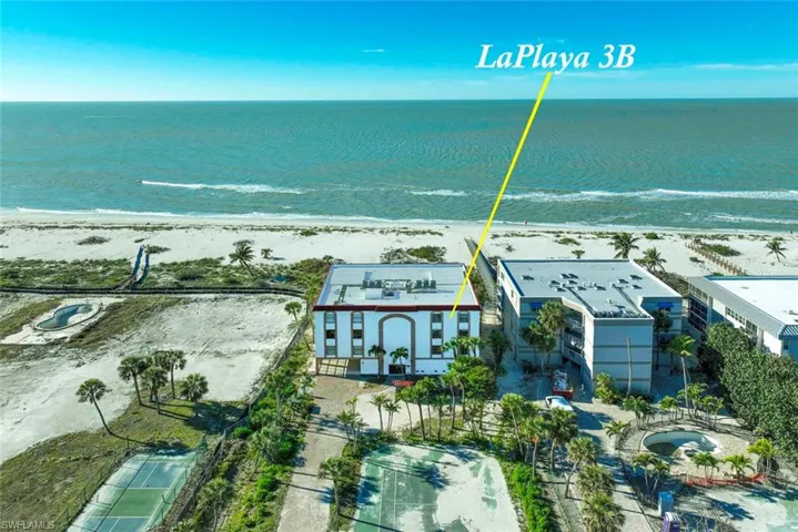 Aerial view featuring a view of the beach and a water view
