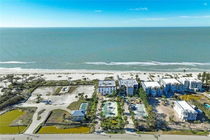 Bird's eye view with a view of the beach and a water view