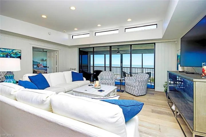 The dominant colors are white and blue, giving the space a crisp, clean, and coastal vibe.