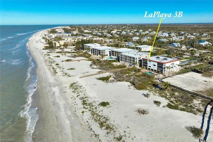 Bird's eye view with a beach view and a water view